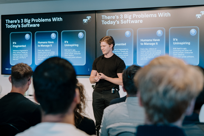 Jaspar Charmichael-Jack from Artisan with slides titled "There's 3 Big Problems with Today's Software" displayed on screen
