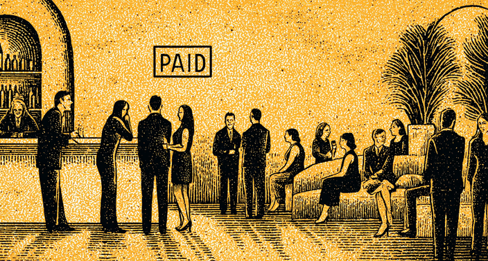 A group of people socializing in a bar with a "PAID" sign above.